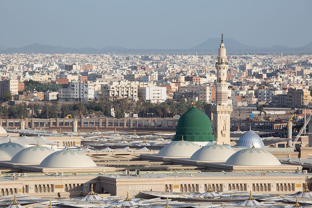 An aerieal view of the Prophet's mosque with its umbrellas, minarets and the Green Dome showing